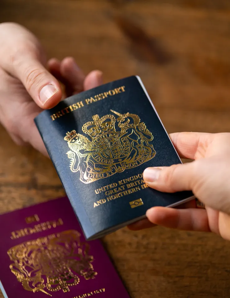 person receiving british passport person receiving british passport